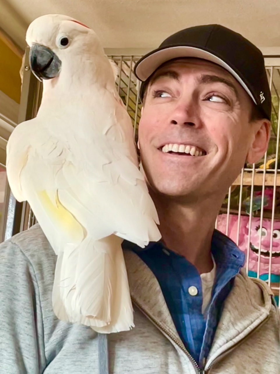 Patrick Broom with Bailey the cockatoo